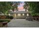 Spacious backyard featuring a concrete patio, outdoor dining area, and a lovely yellow door at 1605 Wellswood Se Dr, Atlanta, GA 30315