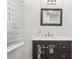 Chic bathroom vanity with decorative mirror, elegant faucet, and bright natural light at 1605 Wellswood Se Dr, Atlanta, GA 30315