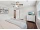 Inviting bedroom features hardwood floors, neutral tones, a ceiling fan, and bright natural light at 1605 Wellswood Se Dr, Atlanta, GA 30315