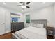 Serene bedroom features hardwood floors, a modern gray bed frame, and bright natural light at 1605 Wellswood Se Dr, Atlanta, GA 30315