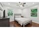 Cozy bedroom with hardwood floors, neutral decor, and large windows offering a bright atmosphere at 1605 Wellswood Se Dr, Atlanta, GA 30315