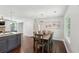 Bright dining area open to the kitchen with hardwood floors and modern decor at 1605 Wellswood Se Dr, Atlanta, GA 30315