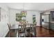Bright dining area with hardwood floors and views of the landscaped backyard at 1605 Wellswood Se Dr, Atlanta, GA 30315