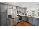This updated kitchen boasts stainless steel appliances and plenty of cabinet space for storage at 1605 Wellswood Se Dr, Atlanta, GA 30315
