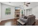 Bright living room featuring a stone fireplace, hardwood floors, and natural light at 1605 Wellswood Se Dr, Atlanta, GA 30315