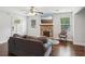 Comfortable living room with a stone fireplace, hardwood floors, and plenty of natural light at 1605 Wellswood Se Dr, Atlanta, GA 30315