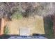 Aerial view of backyard featuring grass and a concrete patio at 1761 Stoney Chase Dr, Lawrenceville, GA 30044