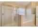 Bright bathroom with a shower and tub combo, and natural light at 1761 Stoney Chase Dr, Lawrenceville, GA 30044