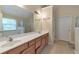 Bathroom features a double vanity, large mirror, and a separate shower and tub at 1761 Stoney Chase Dr, Lawrenceville, GA 30044