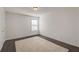 Bright bedroom featuring dark hardwood floors, and one window at 1761 Stoney Chase Dr, Lawrenceville, GA 30044