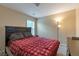 Cozy bedroom with a comfortable bed, soft lighting, and neutral decor, creating a relaxing retreat at 1761 Stoney Chase Dr, Lawrenceville, GA 30044