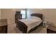 The bedroom includes neutral paint, carpet flooring, and dark wood furnishings at 1761 Stoney Chase Dr, Lawrenceville, GA 30044