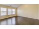 Sunlit bedroom with hardwood floors and multiple windows offering ample natural light at 1761 Stoney Chase Dr, Lawrenceville, GA 30044