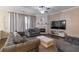 Cozy living room features a fireplace, plush seating, and a modern entertainment center at 1761 Stoney Chase Dr, Lawrenceville, GA 30044