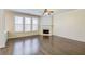 Spacious living room with hardwood floors, fireplace, and natural light at 1761 Stoney Chase Dr, Lawrenceville, GA 30044