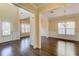 Open concept living space featuring hardwood floors, wainscoting, and abundant natural light at 1761 Stoney Chase Dr, Lawrenceville, GA 30044