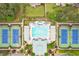 Aerial view of the pool and tennis courts surrounded by lush greenery and manicured landscapes at 285 Turtle Rock Pl, Acworth, GA 30101