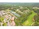 Expansive aerial view of community amenities including a pool, tennis courts, surrounded by green space and established homes at 285 Turtle Rock Pl, Acworth, GA 30101