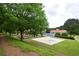 Community amenities featuring a pool, playground, and volleyball court, set amidst lush greenery and well-maintained landscaping at 285 Turtle Rock Pl, Acworth, GA 30101