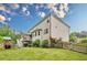 Spacious backyard with a wooden fence, deck and play set providing ample space for outdoor activities and Gathering fun at 285 Turtle Rock Pl, Acworth, GA 30101