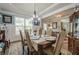 Refined dining area with chandelier, large window, and seating for six at 285 Turtle Rock Pl, Acworth, GA 30101