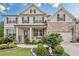 Beautiful two-story home with a brick and siding exterior, landscaped front yard, and attached garage at 285 Turtle Rock Pl, Acworth, GA 30101