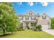 Charming two-story home featuring brick accents, a well-manicured lawn, and a welcoming front porch at 285 Turtle Rock Pl, Acworth, GA 30101