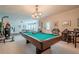 Game room features a billiard table and doorway to the outside, perfect for entertaining at 285 Turtle Rock Pl, Acworth, GA 30101