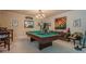 Open concept game room with billiard table and adjoining workout area at 285 Turtle Rock Pl, Acworth, GA 30101