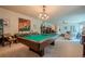 Bright game room with a classic billiard table and a modern chandelier at 285 Turtle Rock Pl, Acworth, GA 30101