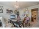 Well-lit home office featuring a chandelier, a work desk with office chairs, and decorative accents at 285 Turtle Rock Pl, Acworth, GA 30101