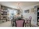 Lovely home office space with eclectic decor, unique lighting, and a large sunny window at 285 Turtle Rock Pl, Acworth, GA 30101