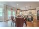 Cozy eat-in kitchen boasts stainless appliances, granite countertops and a table overlooking an outdoor patio at 285 Turtle Rock Pl, Acworth, GA 30101