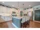This kitchen features a center island, stainless appliances, granite countertops and beautiful hardwood floors at 285 Turtle Rock Pl, Acworth, GA 30101