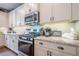 The kitchen has stainless appliances, granite countertops, and tiled backsplash at 285 Turtle Rock Pl, Acworth, GA 30101