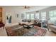 Comfortable living room with a plush sofa, large windows, and natural light at 285 Turtle Rock Pl, Acworth, GA 30101