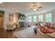 Bright and airy living room with a fireplace, hardwood floors, and comfortable seating at 285 Turtle Rock Pl, Acworth, GA 30101