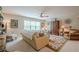 Bright living room featuring neutral colors, a ceiling fan, and a floral area rug, perfect for relaxation and comfort at 285 Turtle Rock Pl, Acworth, GA 30101
