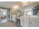 Bright main bathroom featuring double sinks with white cabinets and a view to the tub/shower at 285 Turtle Rock Pl, Acworth, GA 30101