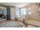 Bright main bathroom with tub and separate shower, wood look flooring, and access to main bedroom at 285 Turtle Rock Pl, Acworth, GA 30101