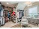 Spacious walk-in closet offering ample storage with built in shelving, drawers, and shoe racks at 285 Turtle Rock Pl, Acworth, GA 30101