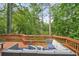 Spacious back deck with wood railings offers outdoor seating for relaxation and entertainment at 3780 Bays Ferry Way, Marietta, GA 30062