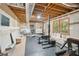 Unfinished basement with exposed beams and workout equipment at 3780 Bays Ferry Way, Marietta, GA 30062