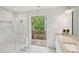Bathroom features a walk-in shower, double vanity and access to a private deck with green views at 3780 Bays Ferry Way, Marietta, GA 30062