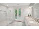 Spa-like bathroom offers a walk-in shower, double vanity, and access to a private deck at 3780 Bays Ferry Way, Marietta, GA 30062