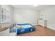 Charming bedroom with a race car bed, ample natural light, and wood flooring at 3780 Bays Ferry Way, Marietta, GA 30062