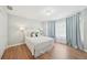 Inviting bedroom with a comfortable bed, soft lighting, and ample natural light at 3780 Bays Ferry Way, Marietta, GA 30062