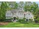Charming two-story home features a well-manicured lawn and beautiful landscaping at 3780 Bays Ferry Way, Marietta, GA 30062