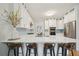 Bright kitchen featuring white cabinetry, stainless appliances, quartz countertops, and accent tile backsplash at 3780 Bays Ferry Way, Marietta, GA 30062