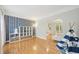 Bright room with hardwood floors, modern wallpaper, and play tent at 3780 Bays Ferry Way, Marietta, GA 30062